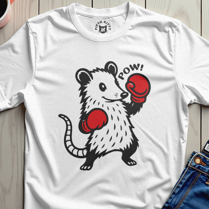 White t-shirt with a cartoon opossum wearing boxing gloves with "POW!" text.