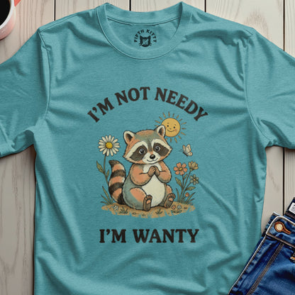 Raccoon sitting with sun and butterflies, text "I'M NOT NEEDY I'M WANTY".