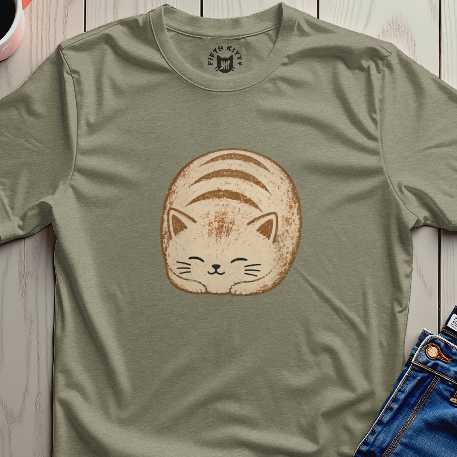 Olive green t-shirt with a rounded, cream-colored cat illustration and a "Fifth Kitty" logo.