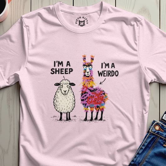 Pink t-shirt with illustrations of a sheep and a colorful llama, text reads "I'M A SHEEP I'M A WEIRDO".