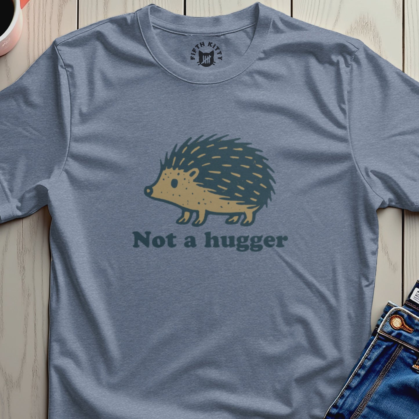 Blue t-shirt with a cartoon hedgehog and text "Not a hugger".