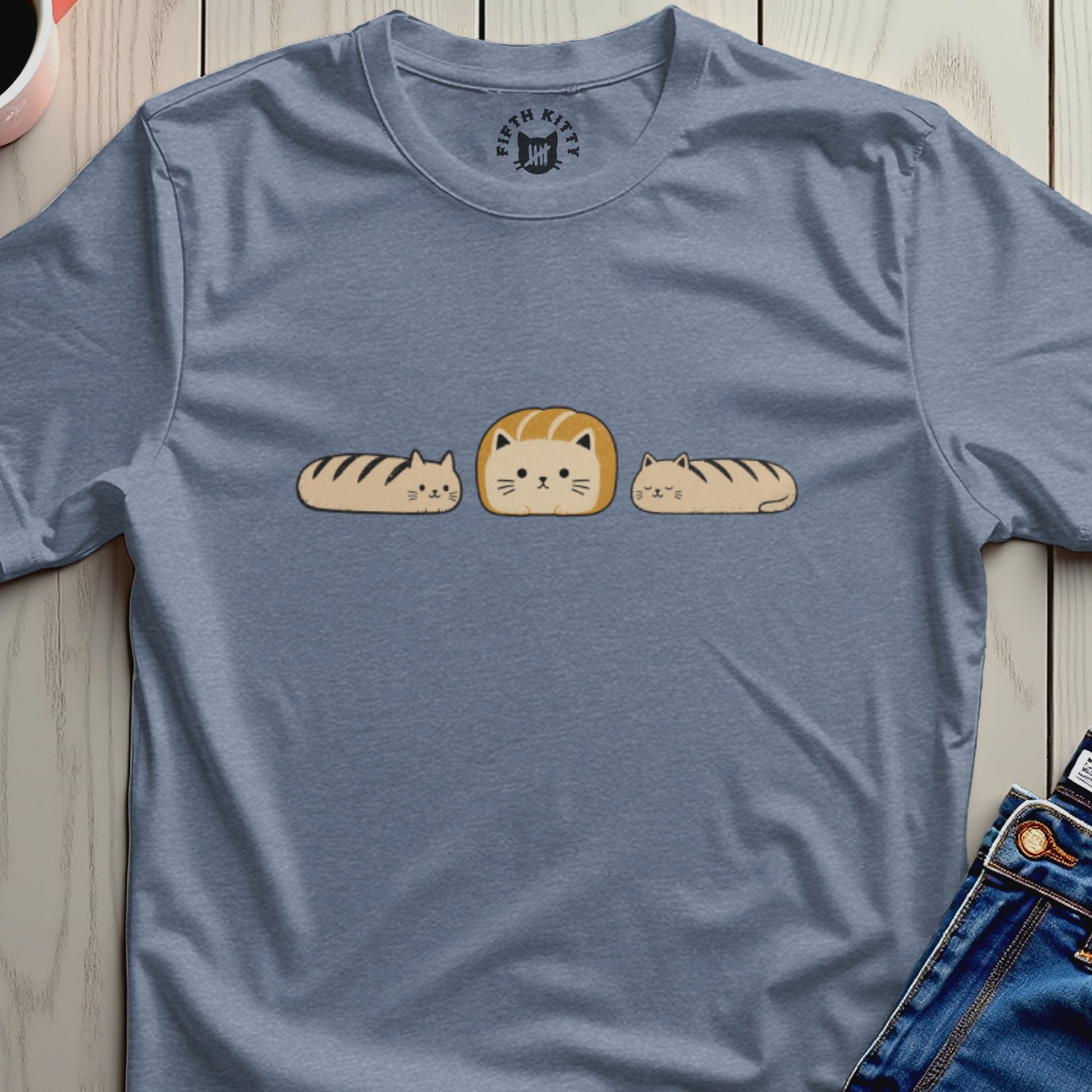 Blue t-shirt with three cartoon loaf cats and Fifth Kitty logo on collar.