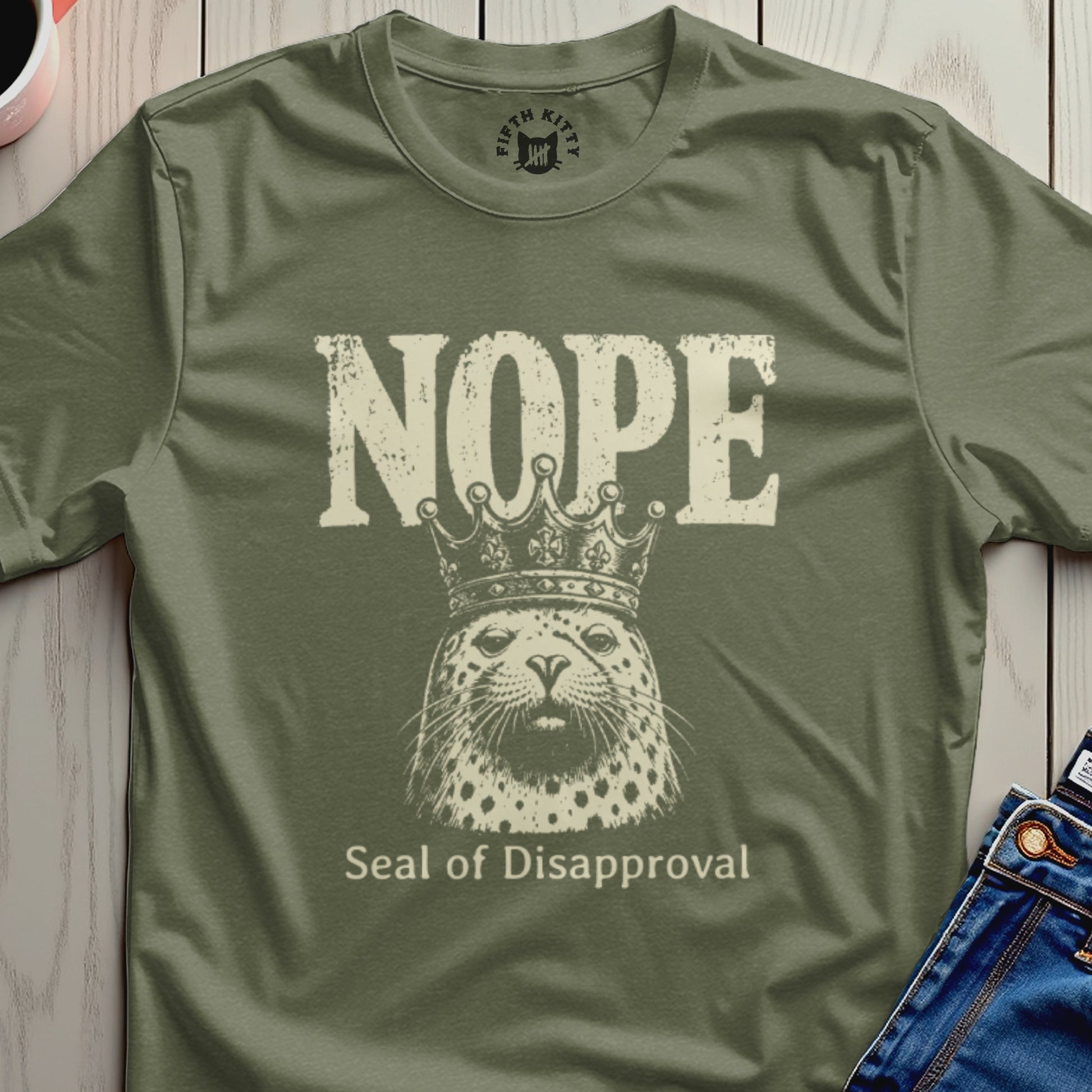 Olive t-shirt with distressed "Nope" text and a leopard wearing a crown with "Seal of Disapproval".
