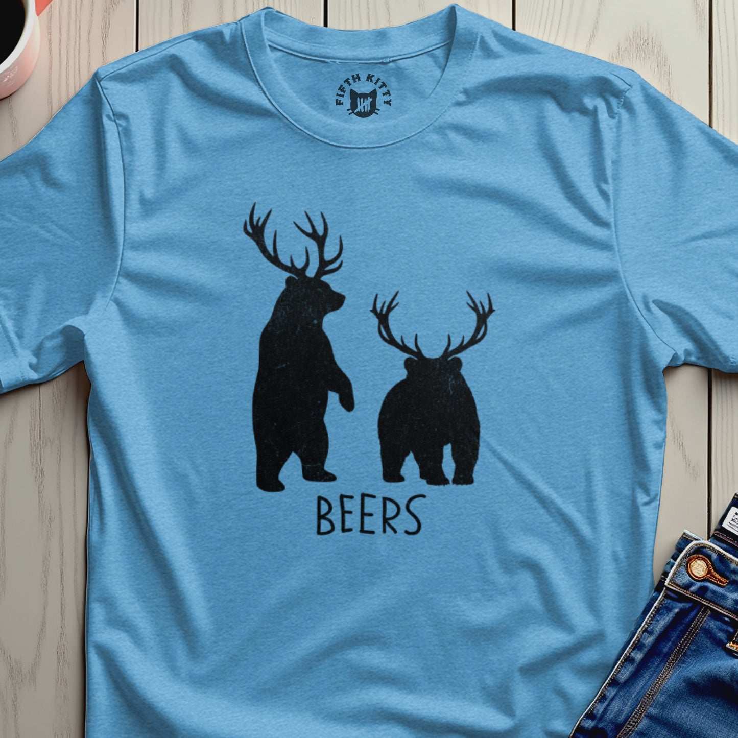 Two bears wearing antlers stand on a blue t-shirt with the word "BEERS" below.