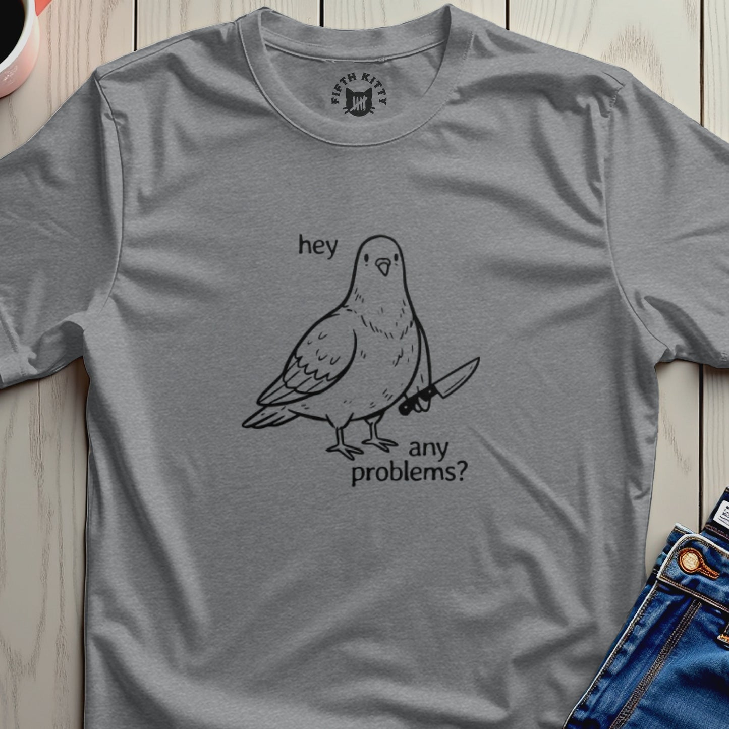 Gray t-shirt with a cartoon pigeon holding a knife and the text "hey any problems?".