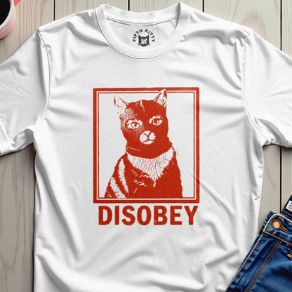 White t-shirt with a red graphic of a cat wearing a ski mask and the word "DISOBEY."