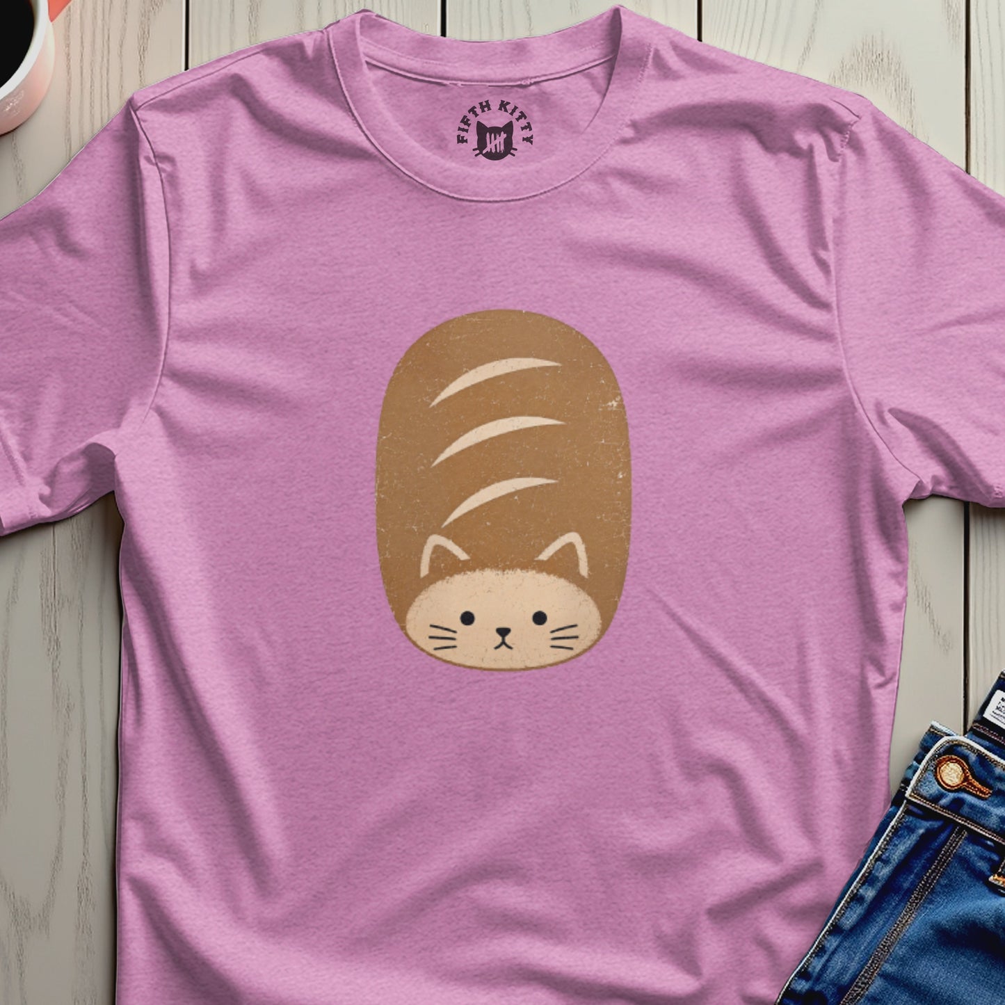 Pink t-shirt with a cartoon cat face on a loaf of bread design.
