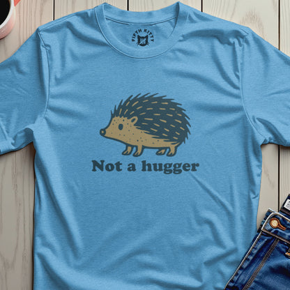 Light blue t-shirt with a hedgehog graphic and "Not a hugger" text.