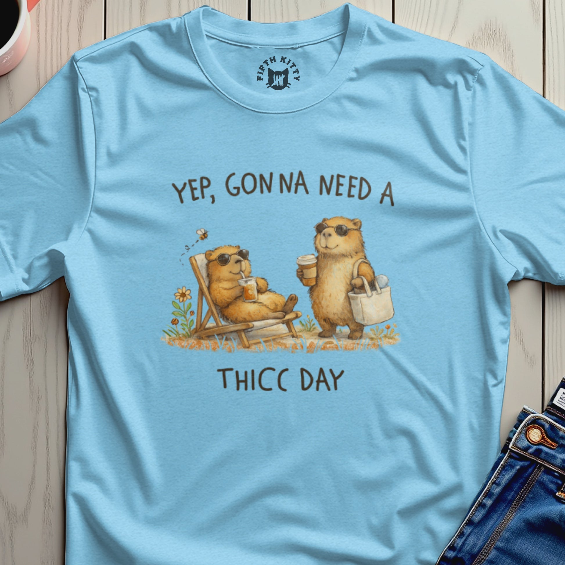 Light blue t-shirt with illustration of bears saying "Yep, Gonna Need a THICC DAY."