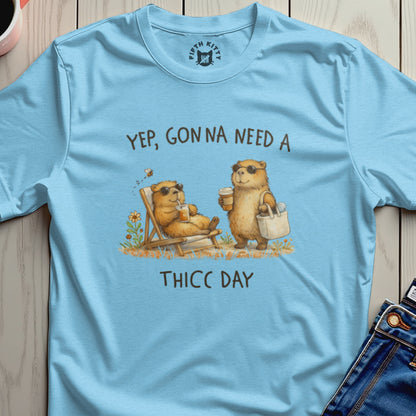 Light blue t-shirt with illustration of bears saying "Yep, Gonna Need a THICC DAY."