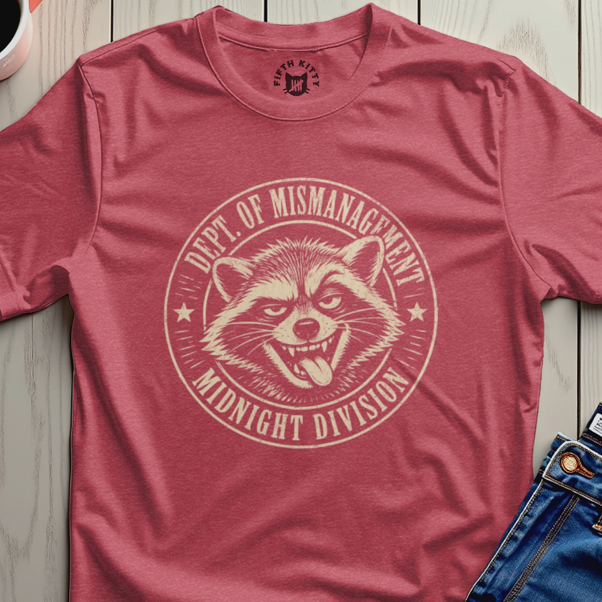 Red t-shirt with "Dept. of Mismanagement Midnight Division" and a raccoon graphic.