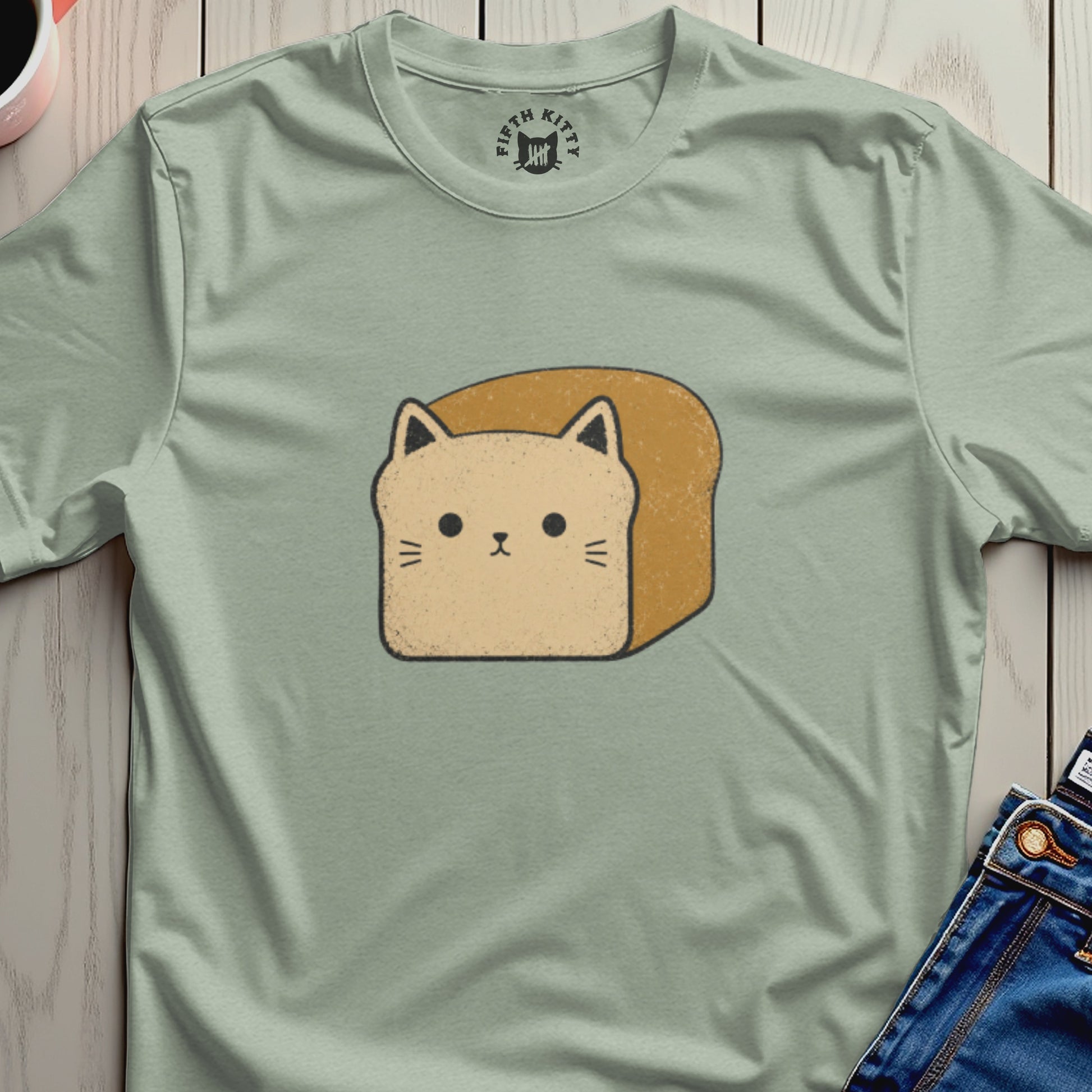 Light green t-shirt with a cartoon cat-loaf graphic and "Fifth Kitty" logo.