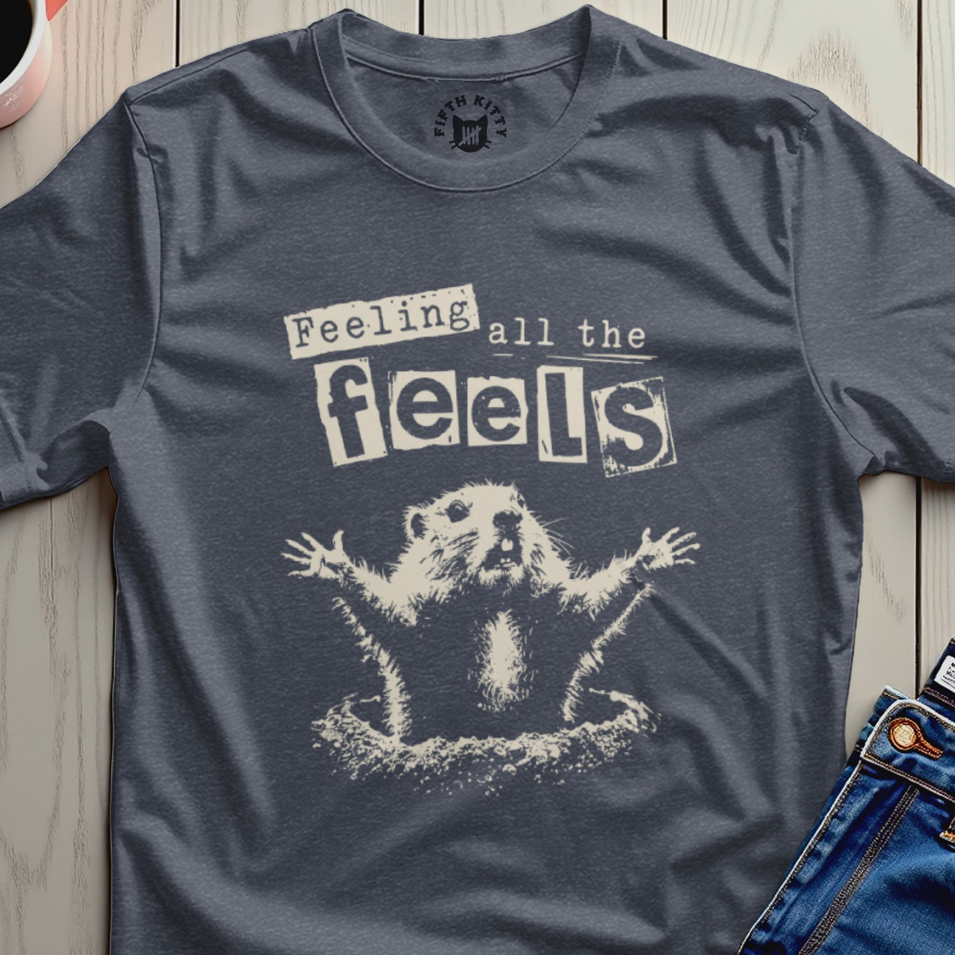 Dark grey t-shirt with a cartoon groundhog surrounded by text "Feeling all the feels".