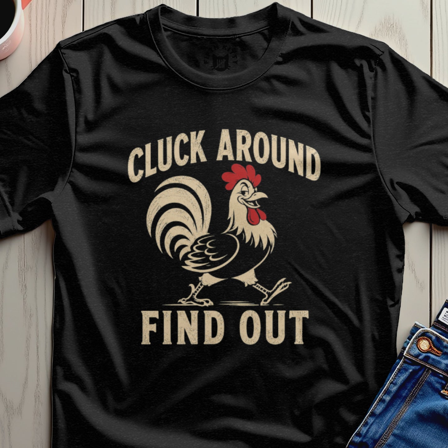 Black t-shirt with chicken graphic and text "CLUCK AROUND FIND OUT"