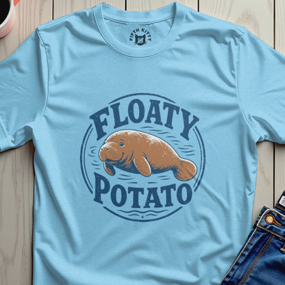 Light blue t-shirt with a graphic of a manatee and text that reads "Floaty Potato".