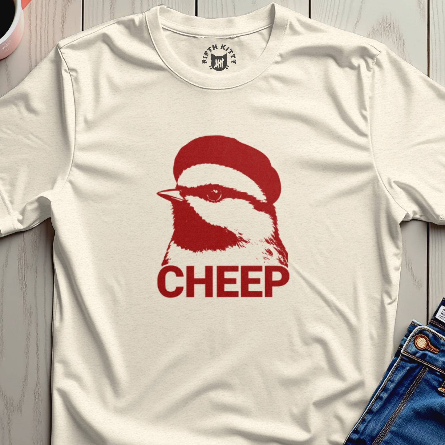 Cream t-shirt with a red chickadee graphic and the word "CHEEP".