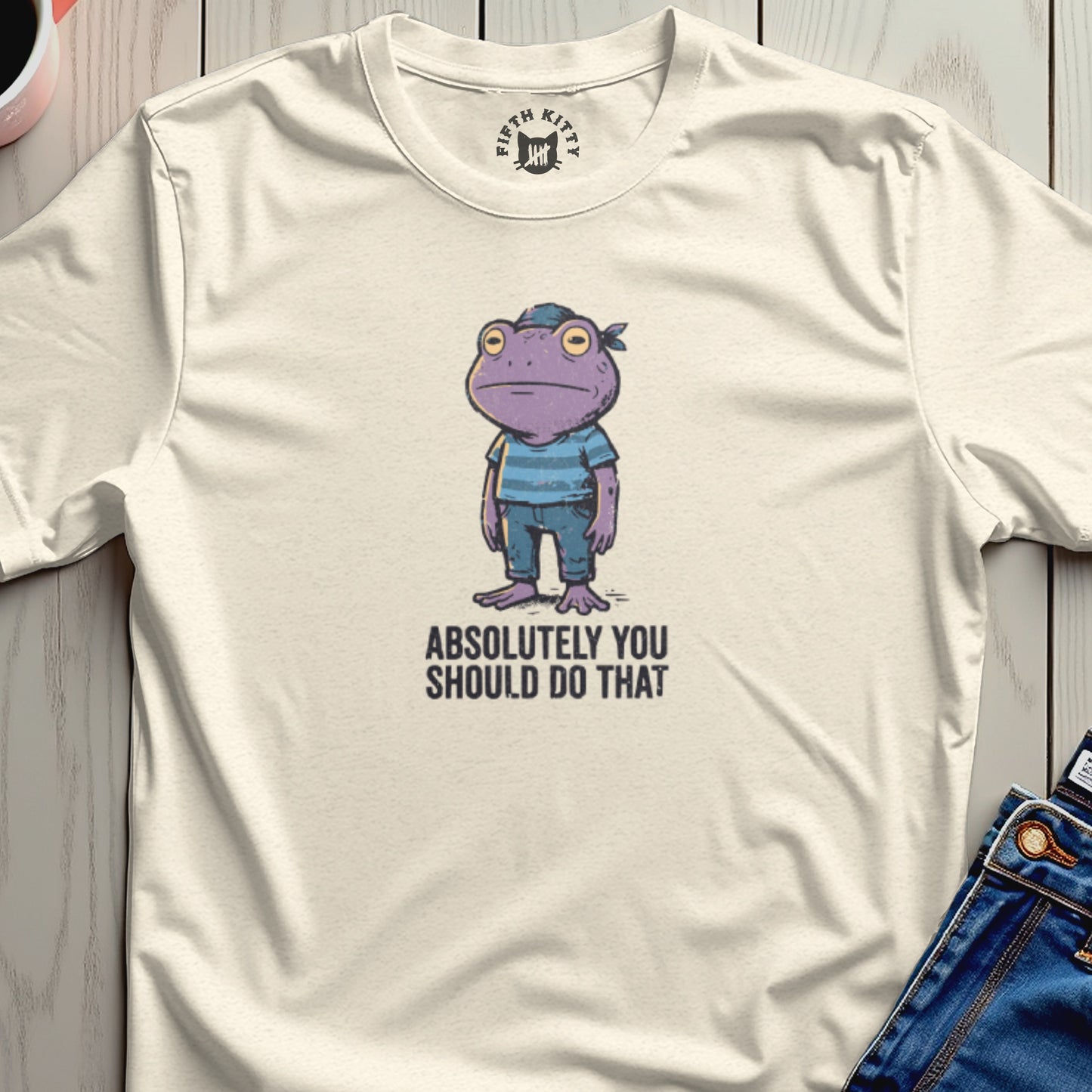 Cream t-shirt with cartoon purple frog wearing bandana and striped shirt, text "ABSOLUTELY YOU SHOULD DO THAT".