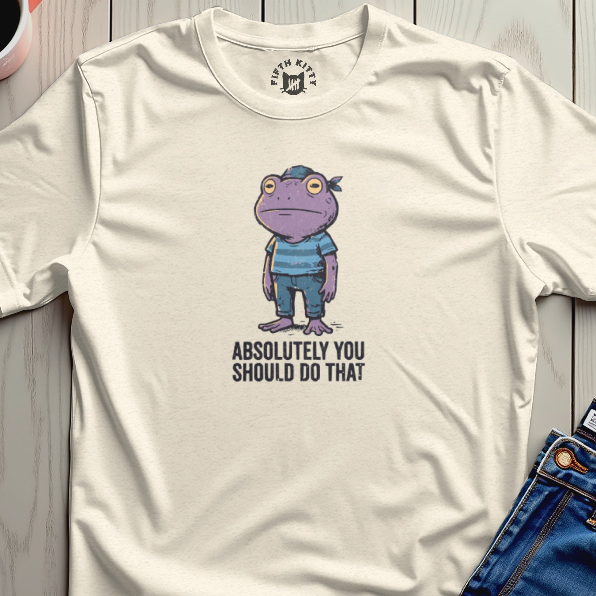 Cream t-shirt with cartoon purple frog wearing bandana and striped shirt, text "ABSOLUTELY YOU SHOULD DO THAT".