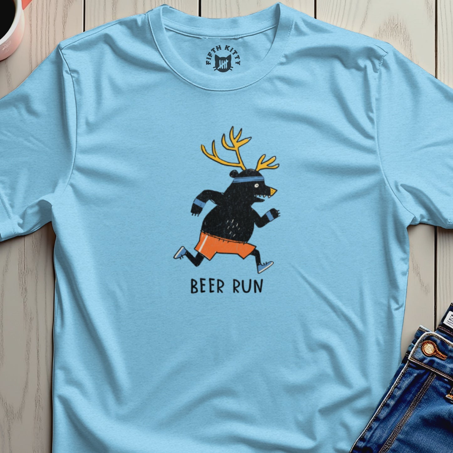 Light blue t-shirt with a cartoon bear wearing antlers and running, text says "Beer Run".