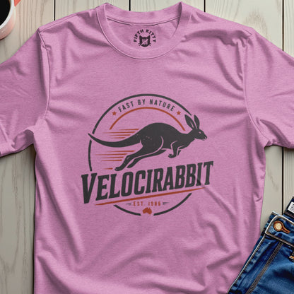 Pink t-shirt with a dark graphic of a velociraptor-like rabbit and the text "Velocirabbit".