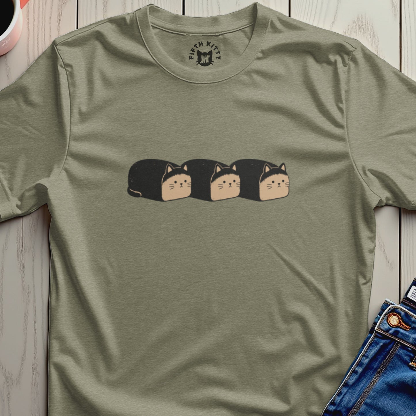 T-shirt with a graphic of three loaf-shaped cats.