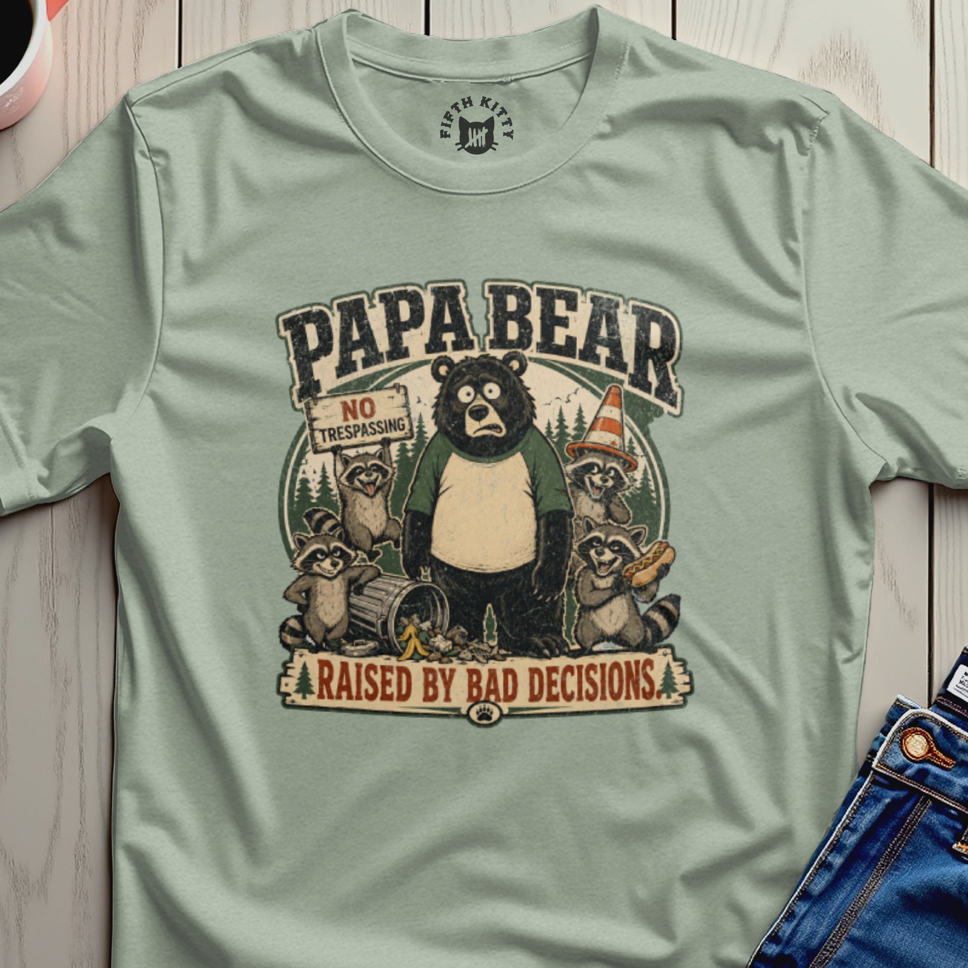 "Papa Bear" graphic tee with cartoon animals and "Raised by Bad Decisions" text.