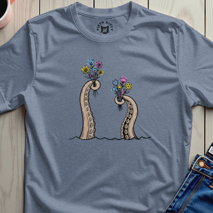 Two tentacle arms emerge from water, holding bouquets of colorful flowers.