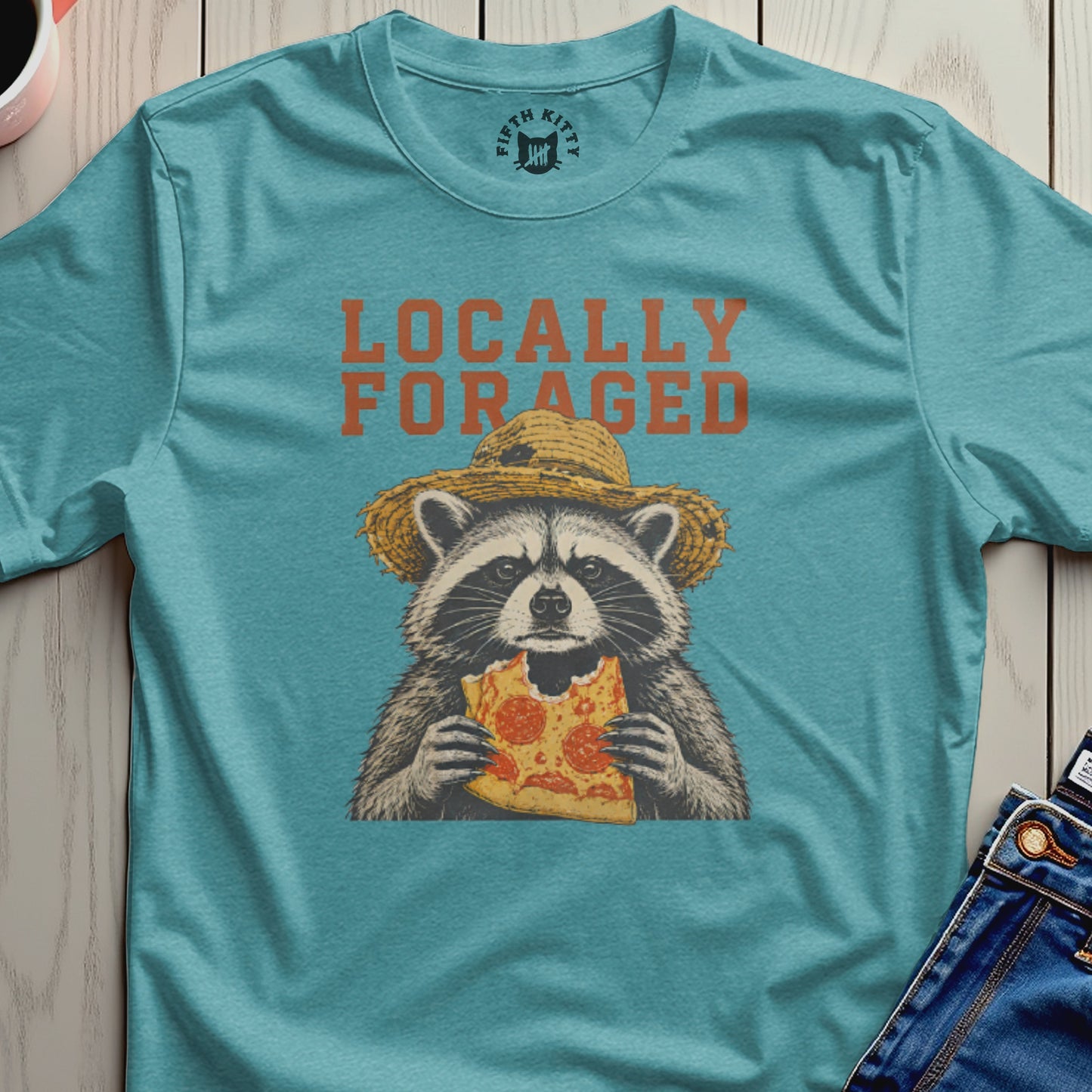 Raccoon wearing a straw hat eats a slice of pizza, "Locally Foraged" text above.