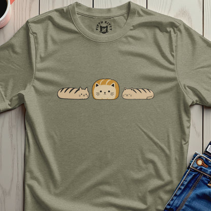 T-shirt with a round logo and three bread-shaped cats on the front.