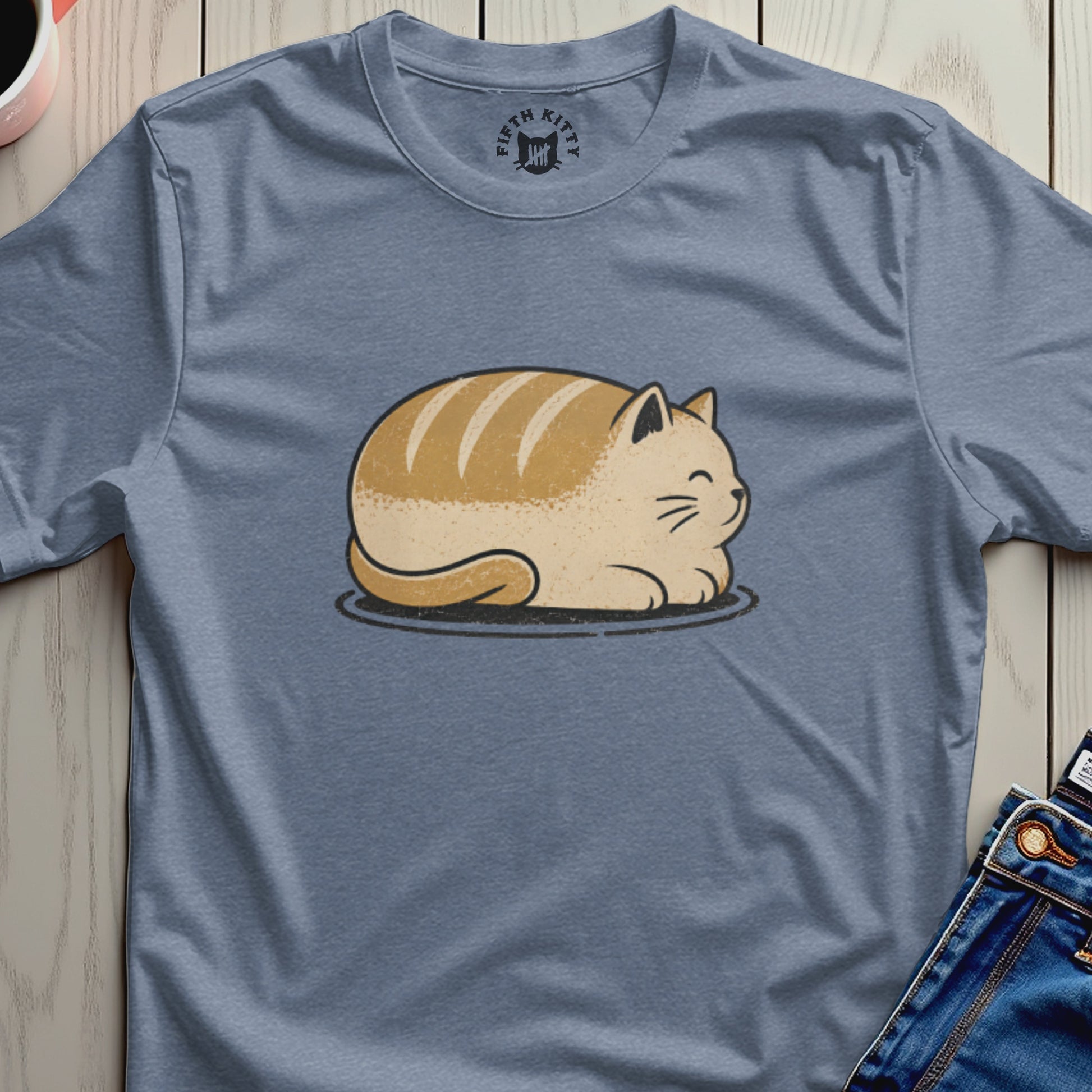 Blue t-shirt with a cartoon cat shaped like a loaf of bread.