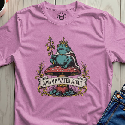Frog wearing a crown sits on a mushroom, with "Swamp Water Stout" banner.