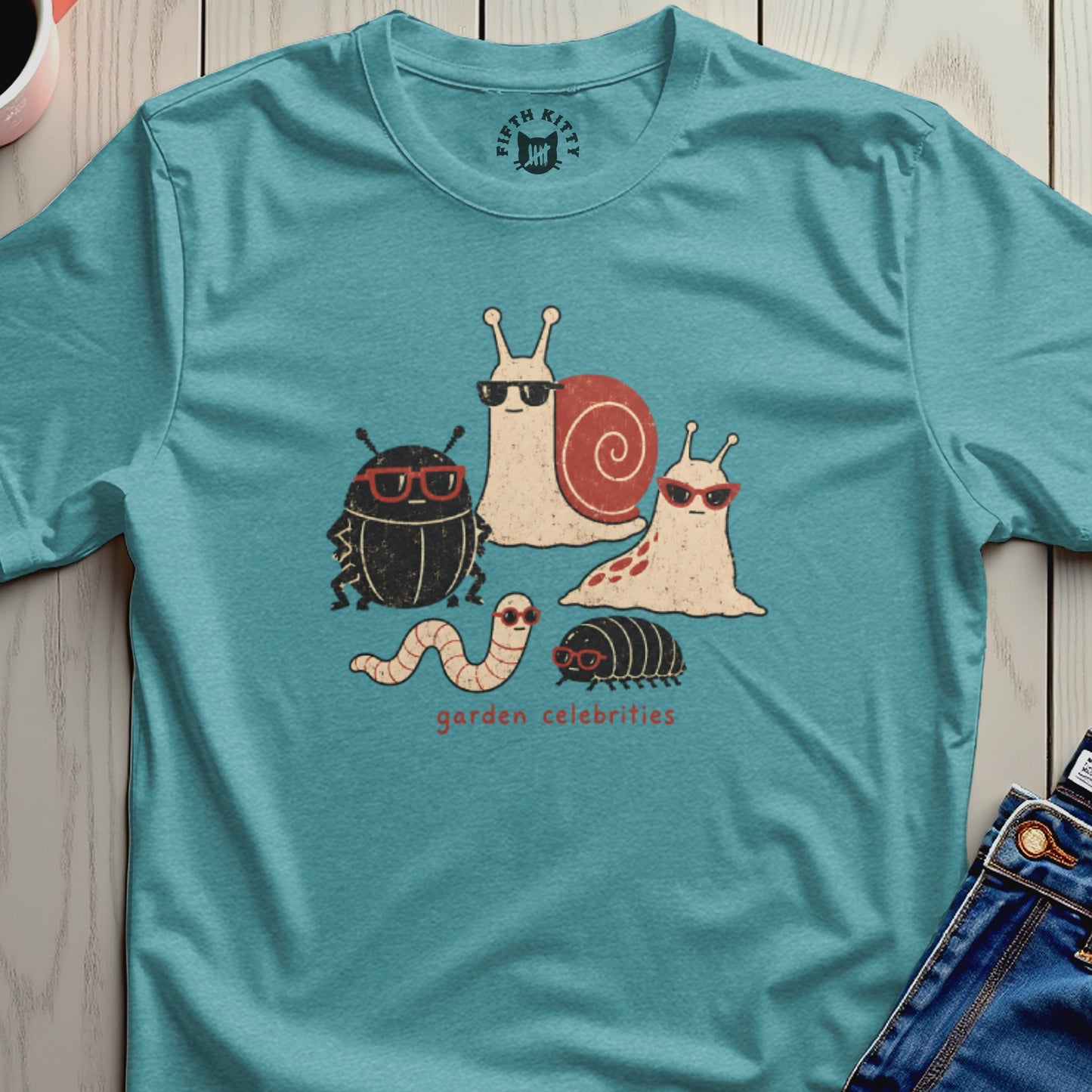Cartoon insects with sunglasses and the text "garden celebrities" on a teal shirt.