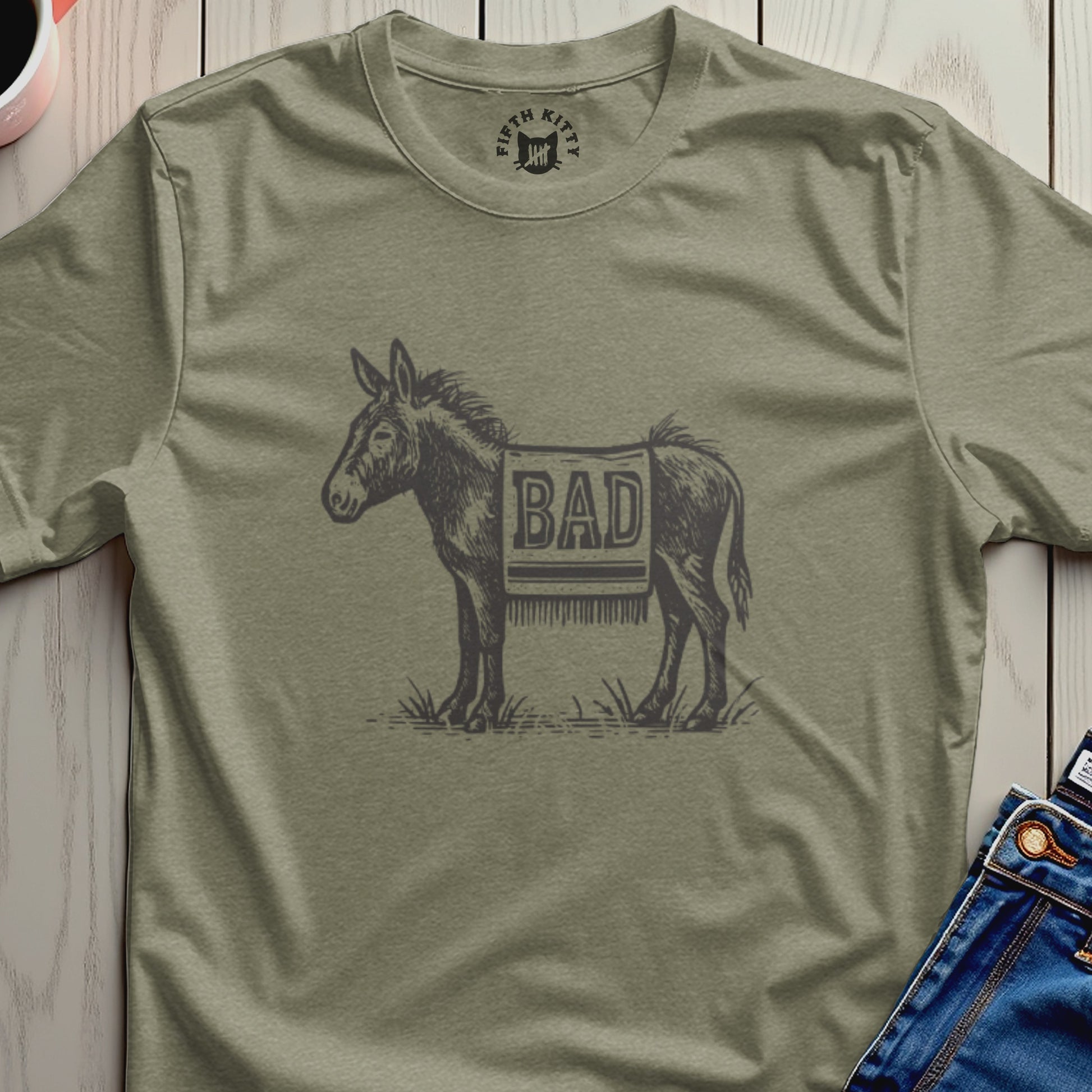 Donkey wearing a blanket with "BAD" printed on it.