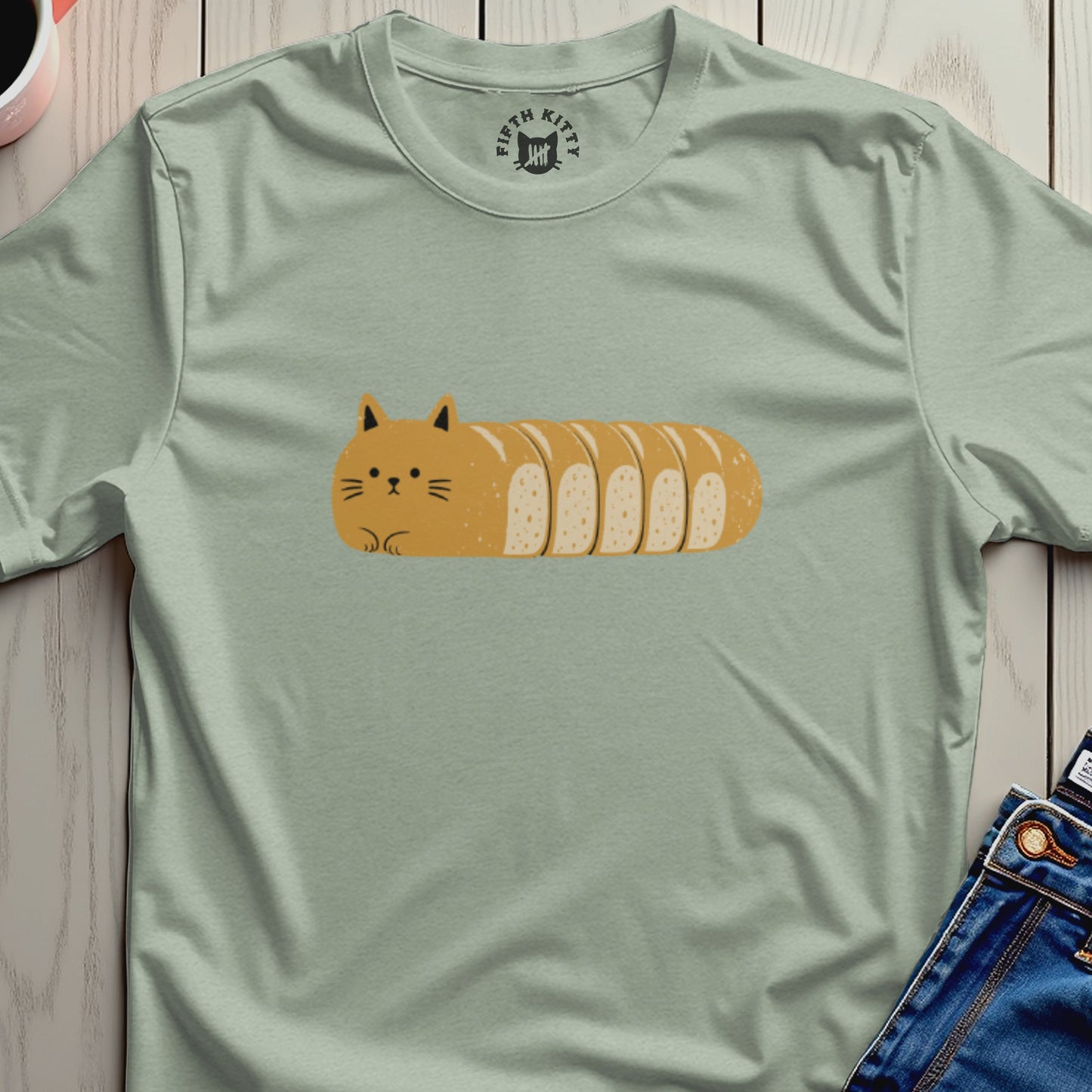 Light green t-shirt with a cartoon cat-loaf design and "FIFTH KITTY" logo.