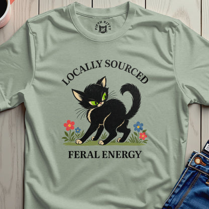 Black cat with green eyes and "Locally Sourced Feral Energy" text.