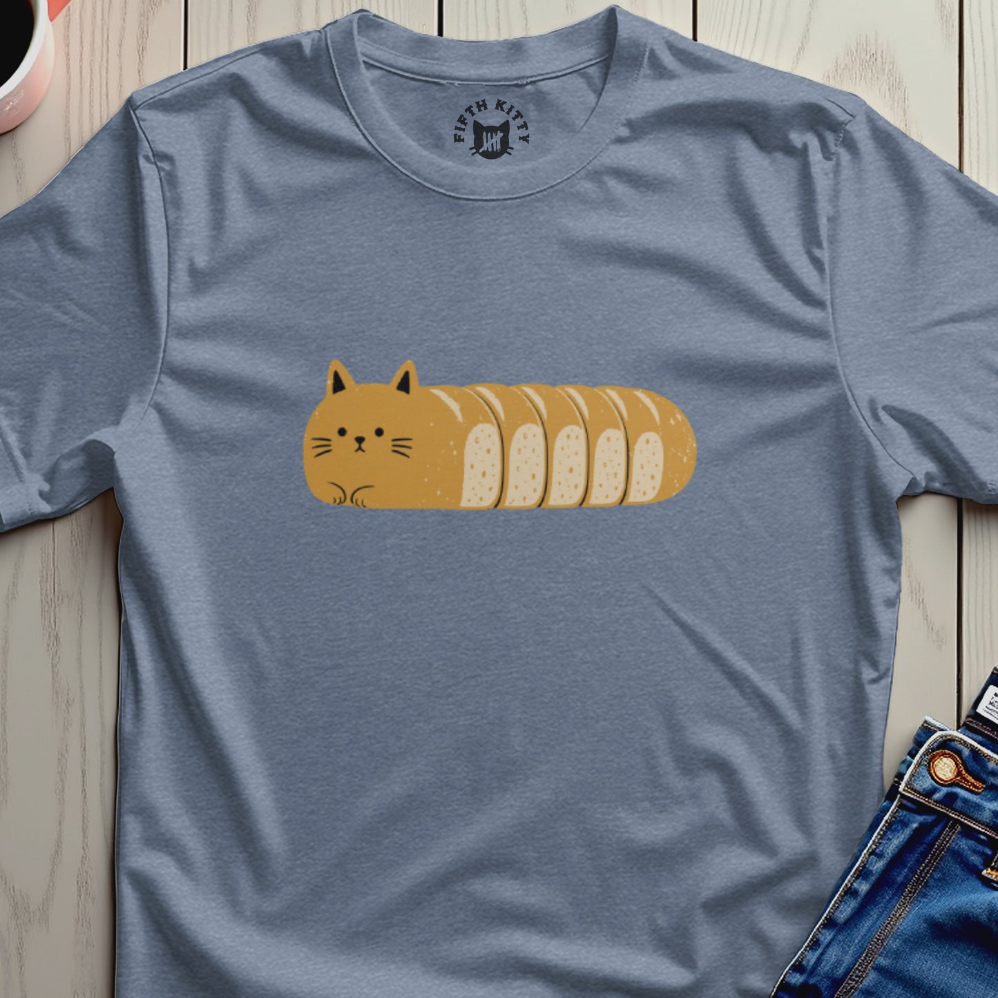 Blue t-shirt with a loaf-shaped cat graphic and Fifth Kitty logo on collar.
