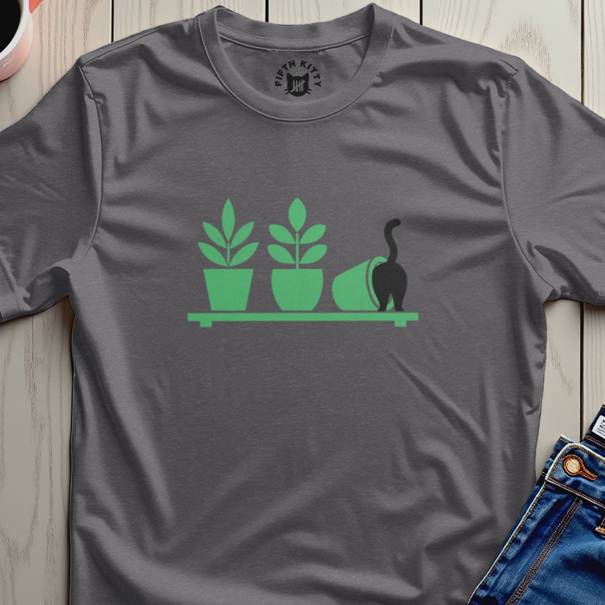 Dark gray t-shirt with a minimalist graphic of plants on a shelf and a cat's tail.