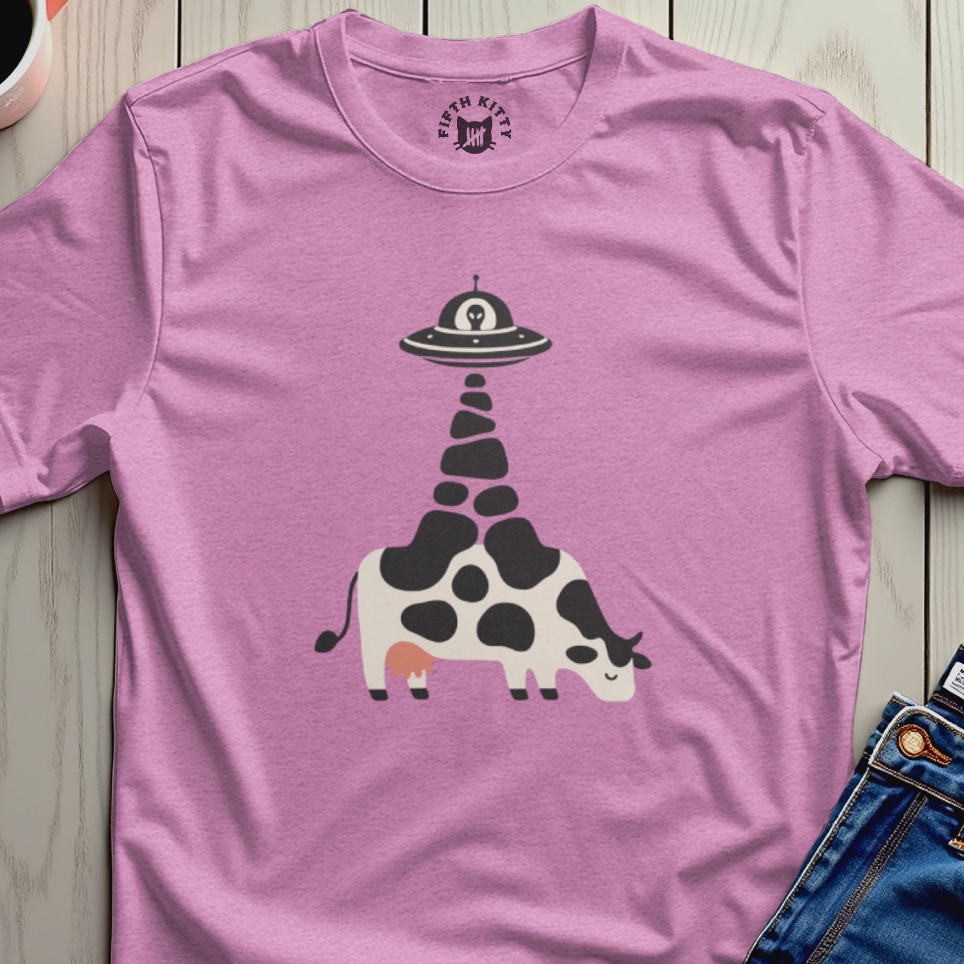Pink t-shirt with alien abduction cow graphic and Fifth Kitty logo on collar.