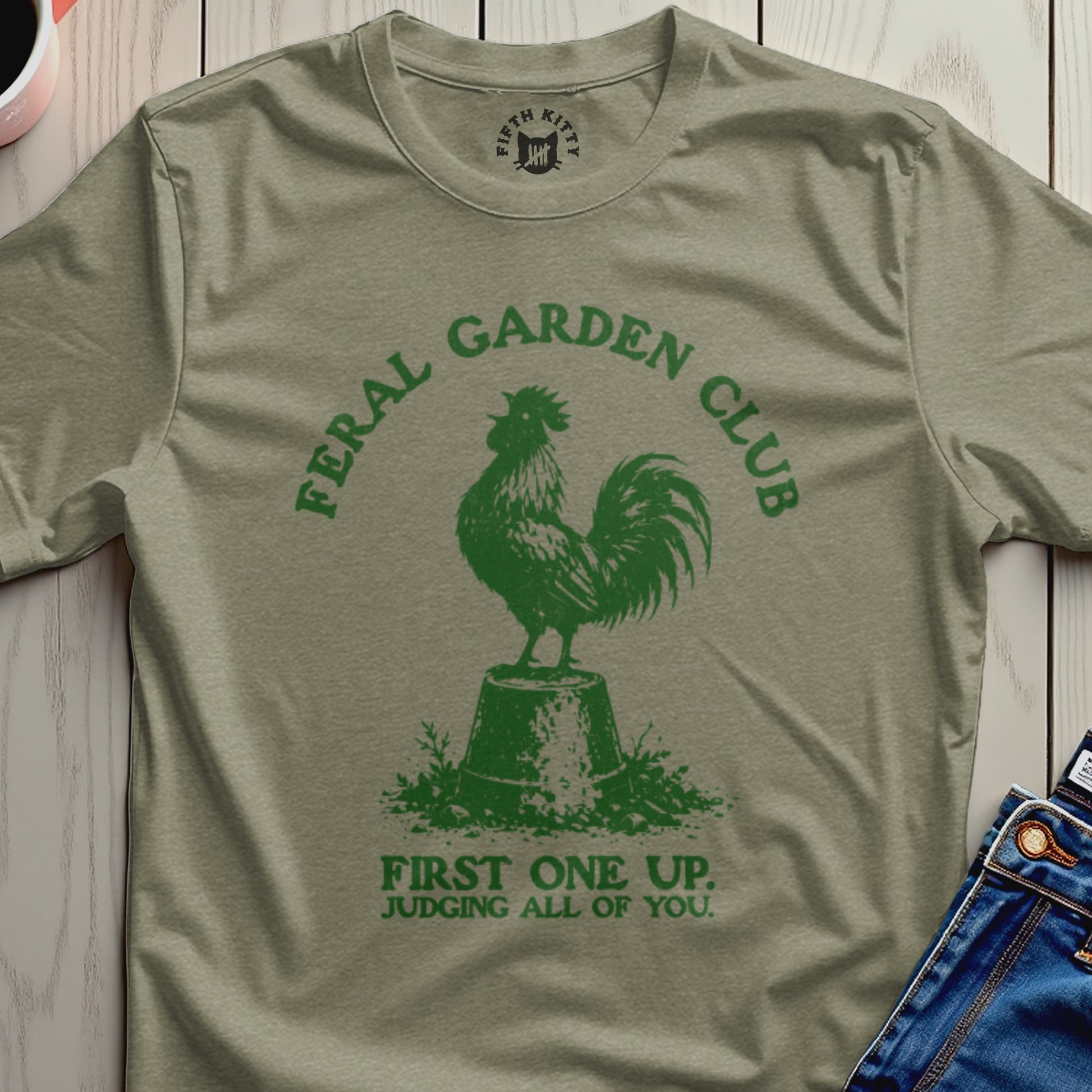 Green t-shirt with rooster graphic and text "Feral Garden Club First One Up. Judging All of You."