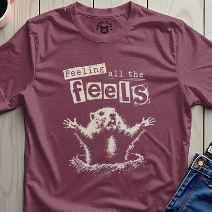 Groundhog with arms outstretched wearing a shirt that says "Feeling all the feels."