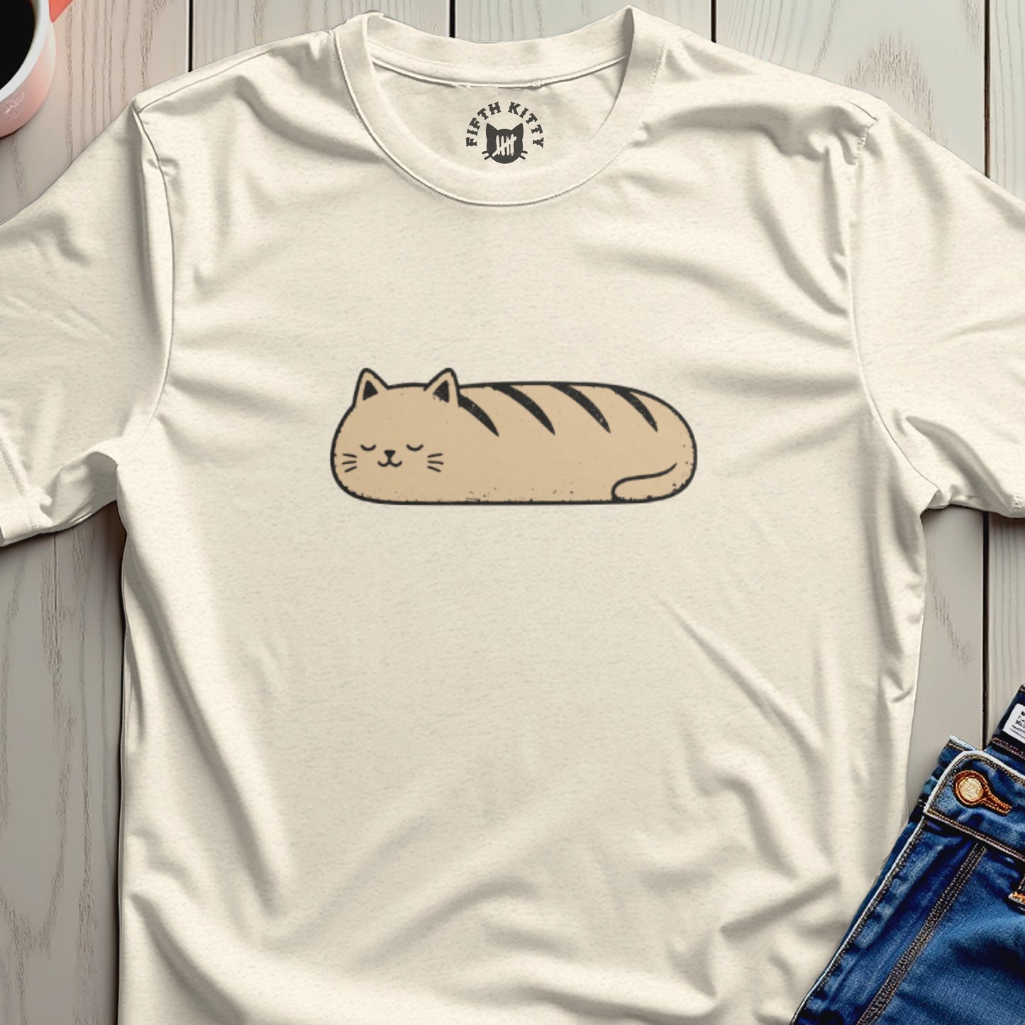 Cream t-shirt with a cartoon cat loaf graphic and "FIFTH KITTY" logo.