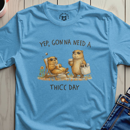 Light blue t-shirt with "Yep, Gonna Need A THICC DAY" and two bears on it.