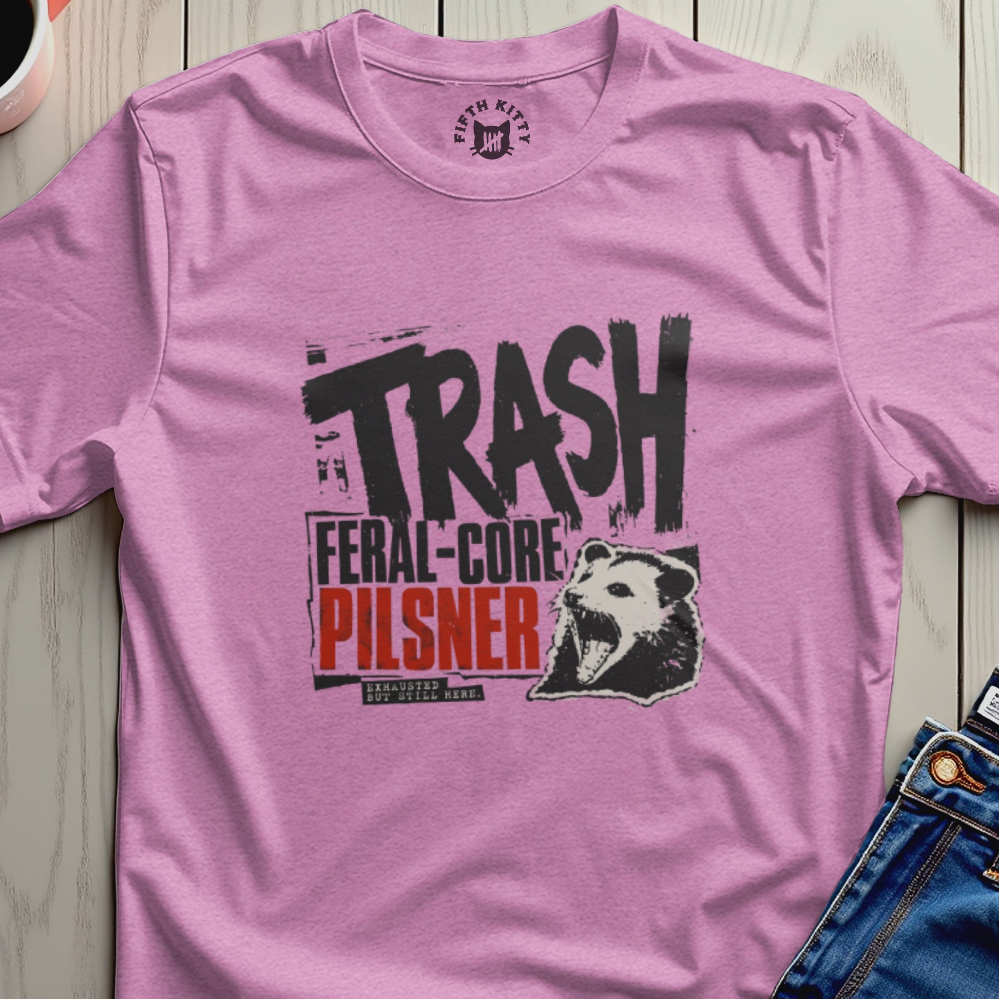 Pink t-shirt with "TRASH FERAL-CORE" text and opossum graphic.