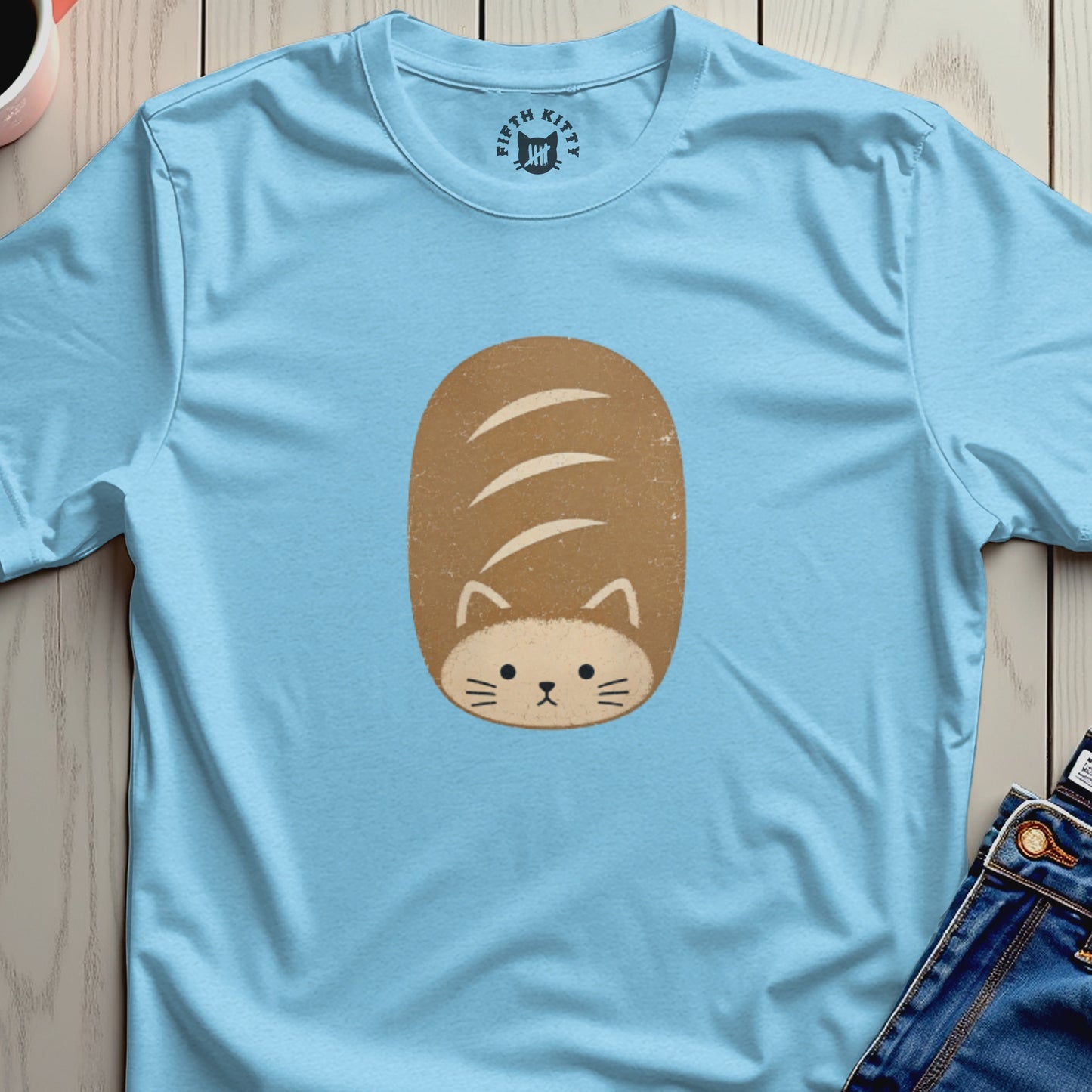 Light blue t-shirt with a cartoon loaf of bread cat graphic.