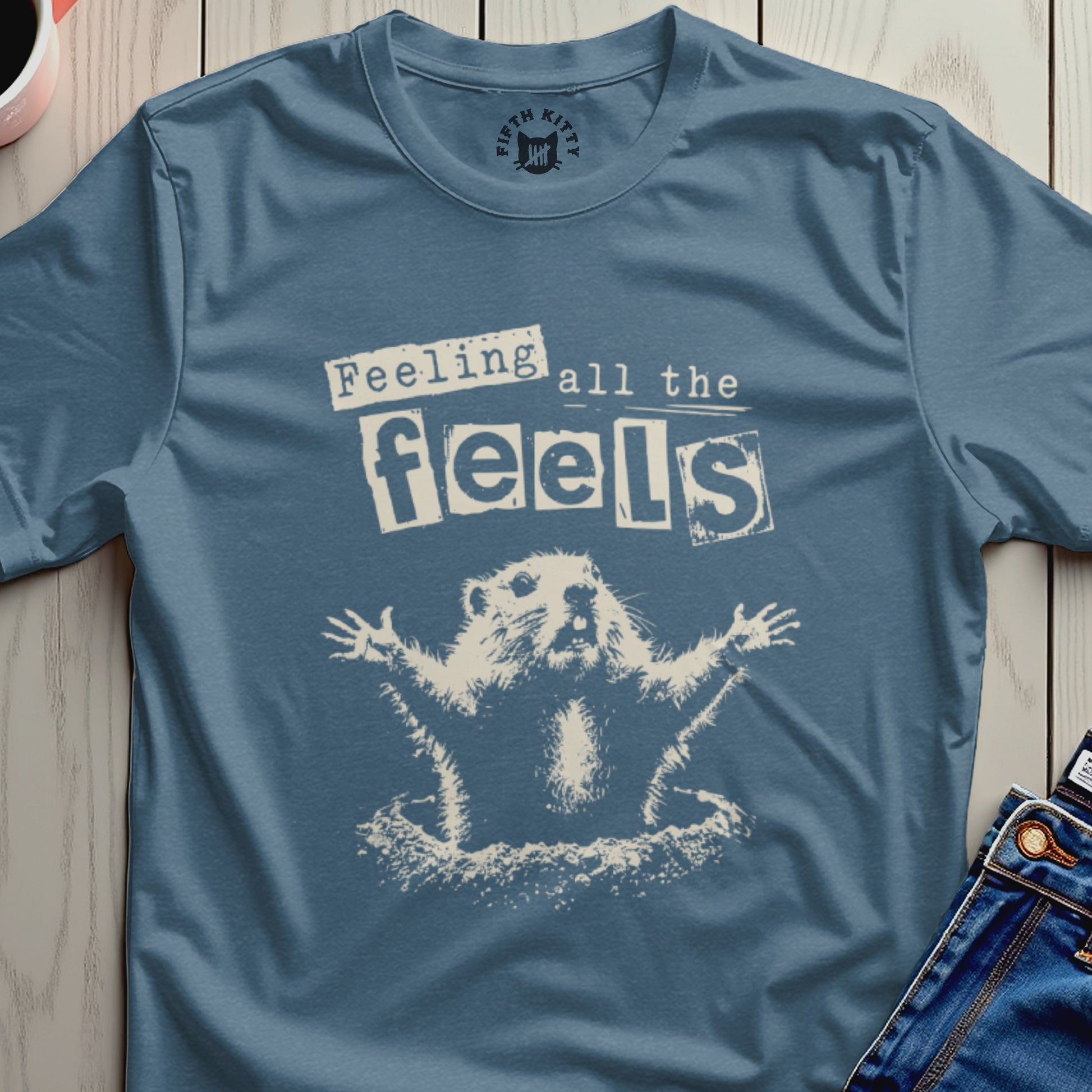 T-shirt with a cartoon groundhog with outstretched arms and "Feeling all the feels" text.