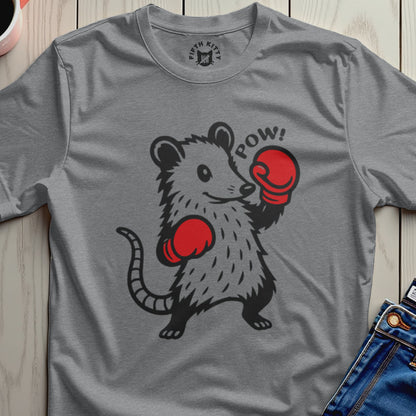 Wrestling possum with red boxing gloves and "POW!" text, on a gray t-shirt.