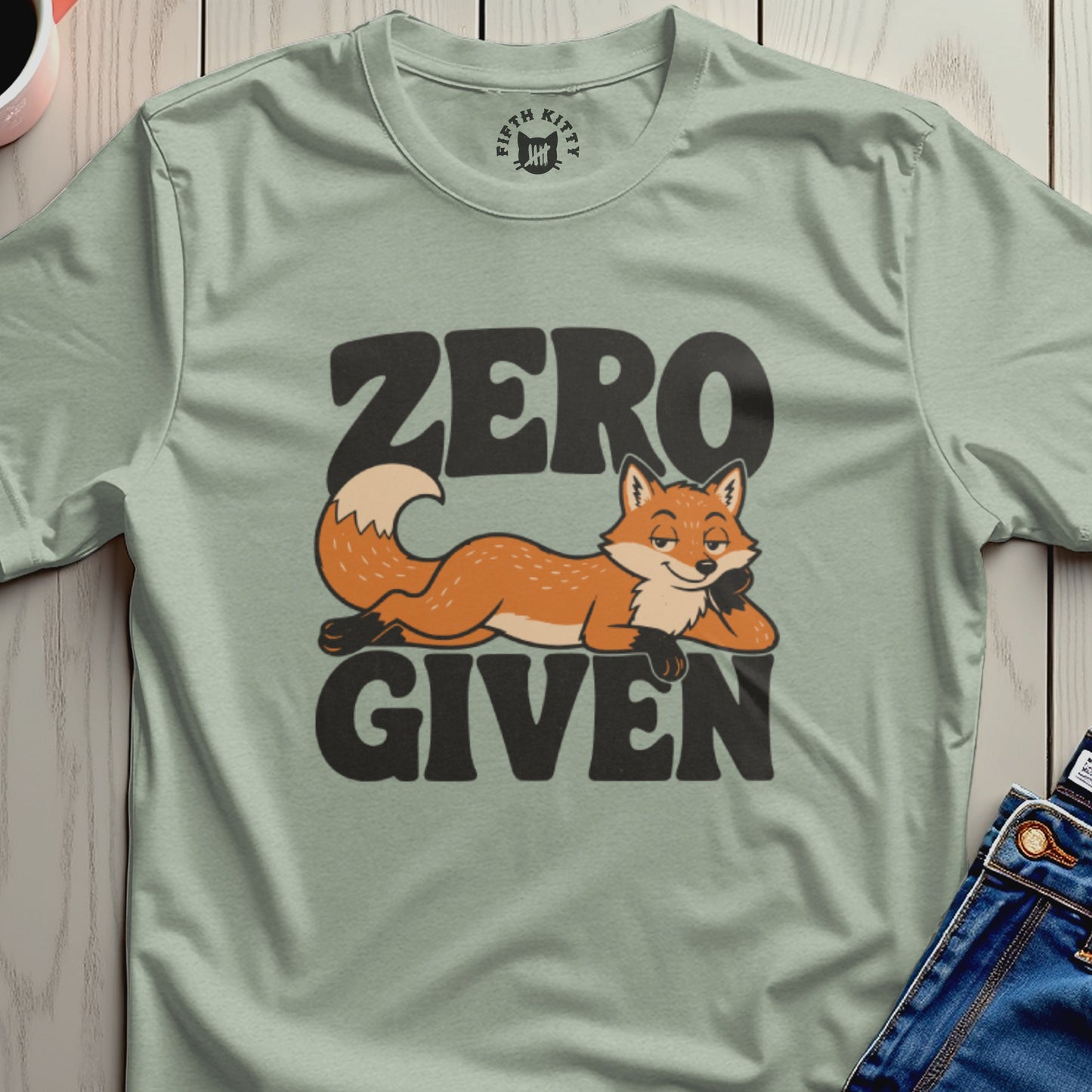 Light green t-shirt with a cartoon fox and "ZERO GIVEN" text.