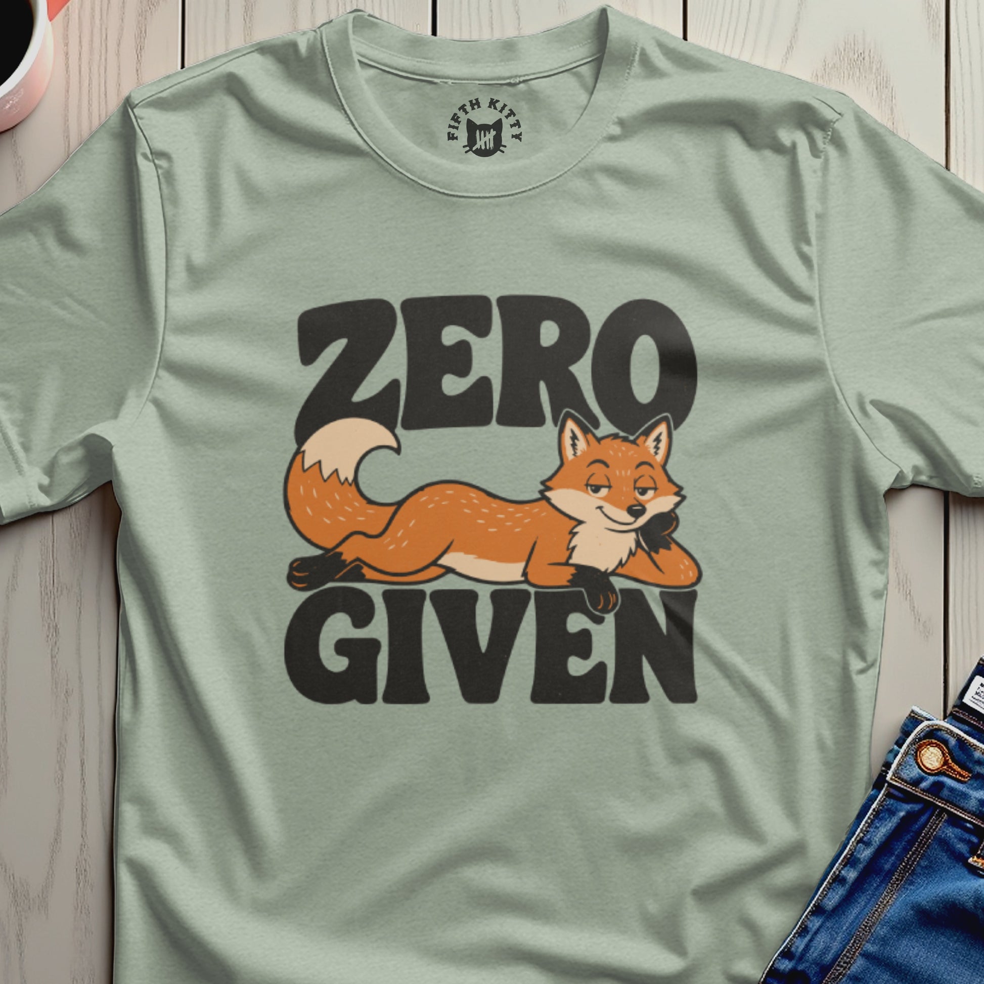 Light green t-shirt with a cartoon fox and "ZERO GIVEN" text.