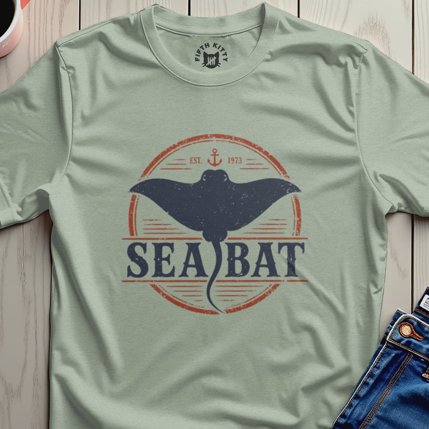 Light green t-shirt with distressed "Sea Bat" graphic and anchor logo.