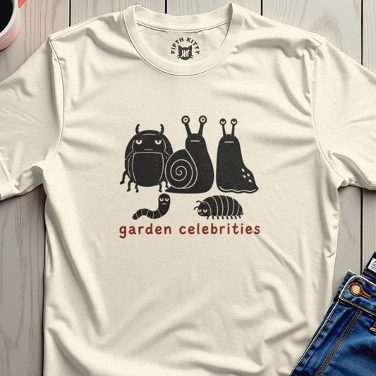 Cream t-shirt with black cartoon bugs and "garden celebrities" text.